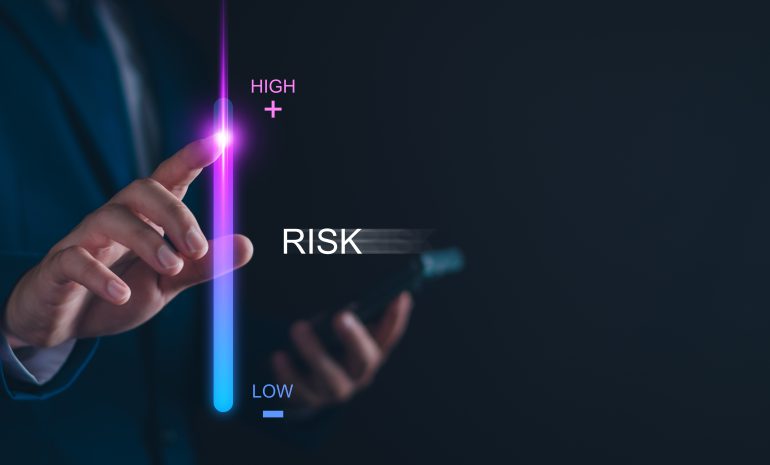 Businessperson adjusting a vertical risk level bar from low to high using a digital interface, symbolizing risk management and decision-making with SpeciCred